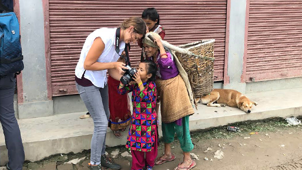 Tracy Showing the Children Her Images