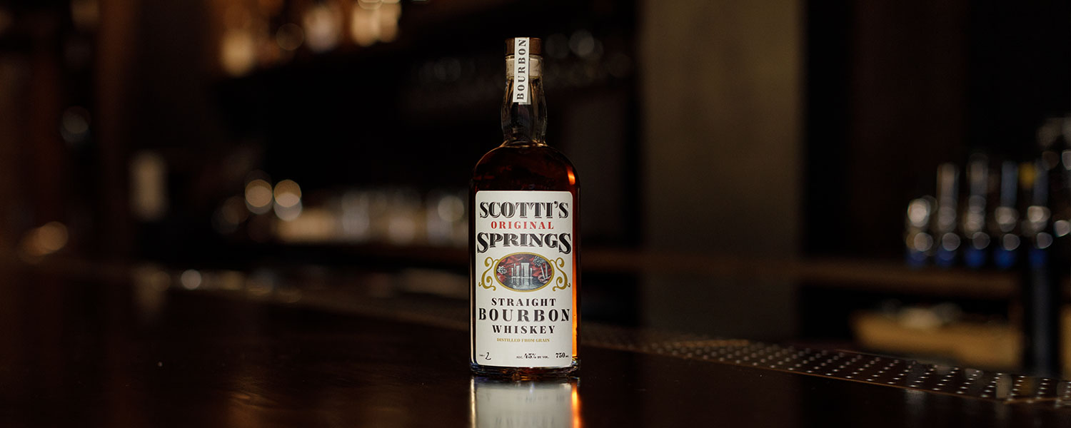 Scotti's bottle on the bar with lighting