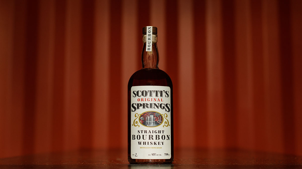 Scotti's bottle with red stripe background